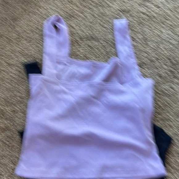 NEW size large but runs more like medium, and a body suit size small.  Lot of 4 - Picture 6 of 9